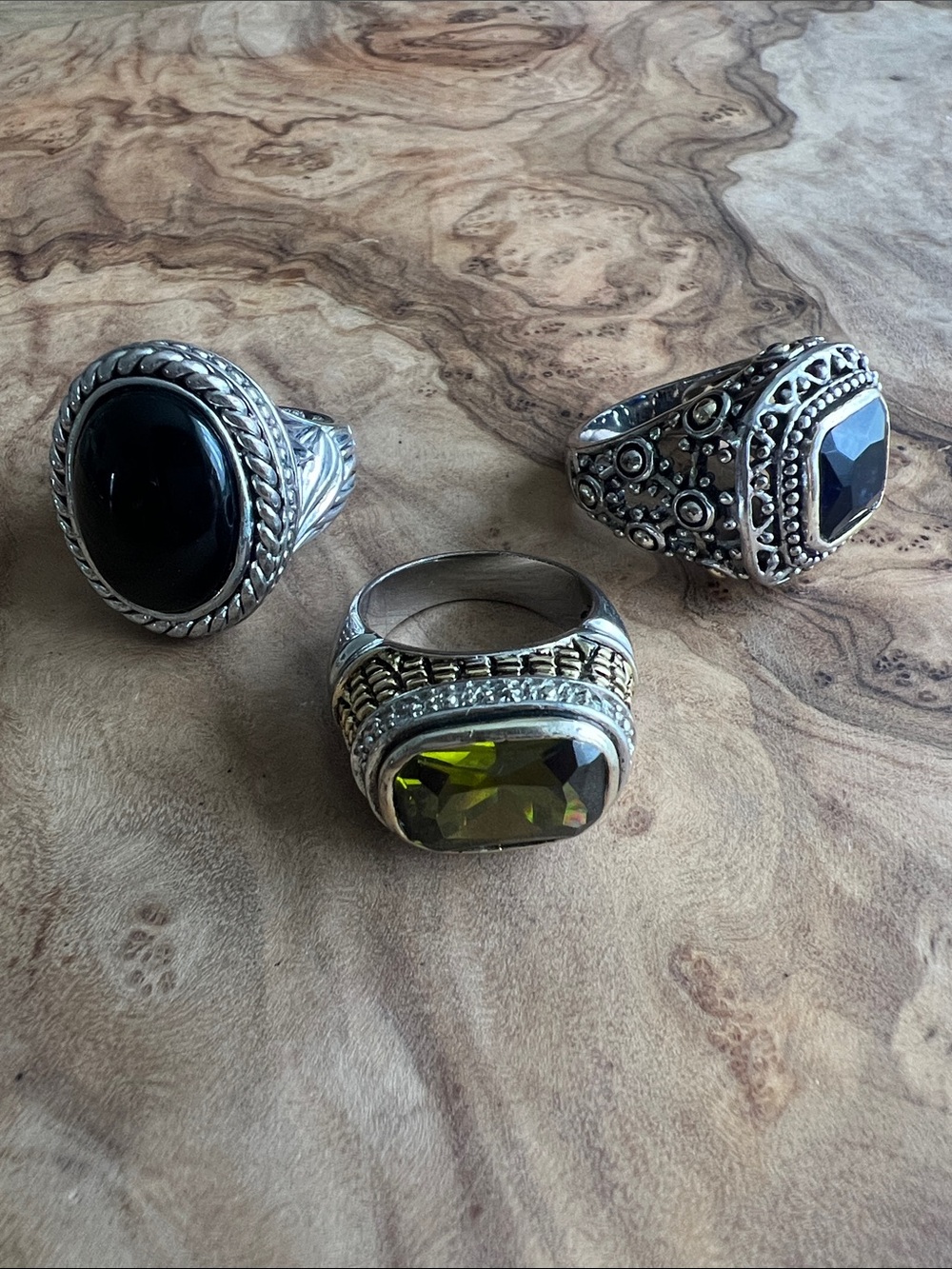 Set of 3 silver-toned cocktail rings. sizes 6 and 7. Unsigned.
